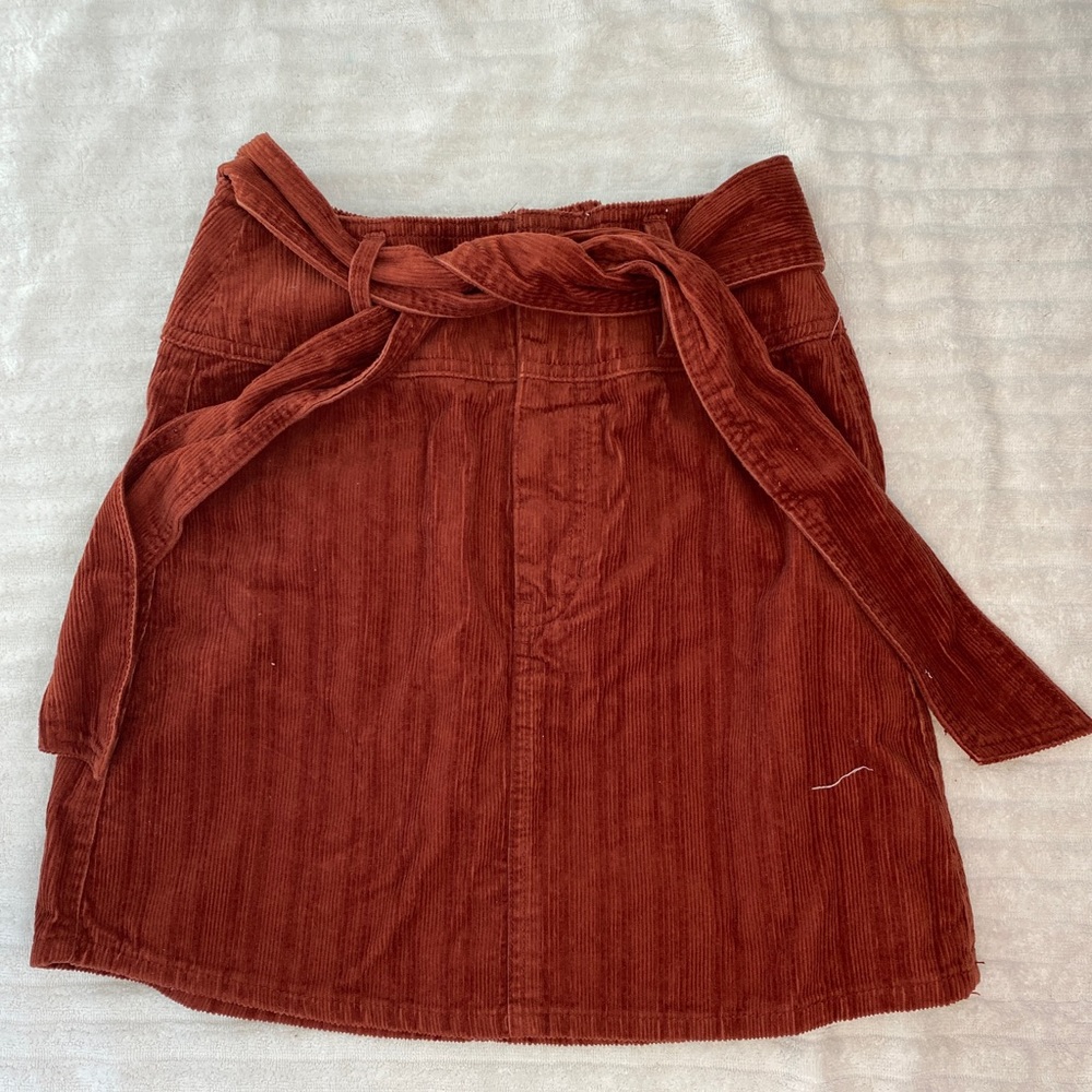 Sure reddish orange skirt